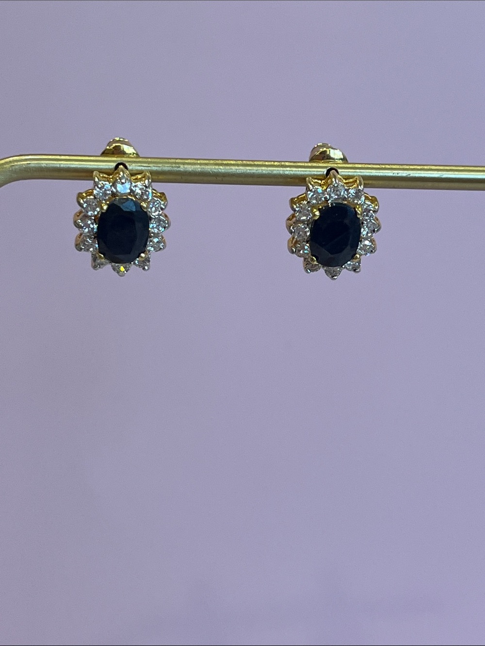 Oval Cut Black Sapphire Halo Earrings set in Gold